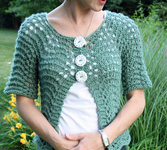 Short sleeve handknit cardigan by by Ysolda Teague; Malabrigo Merino Worsted Yarn, color 506 mint