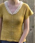 Hand-knit short sleeved pullover sweater made with Malabrigo Merino Sock Yarn color ochre